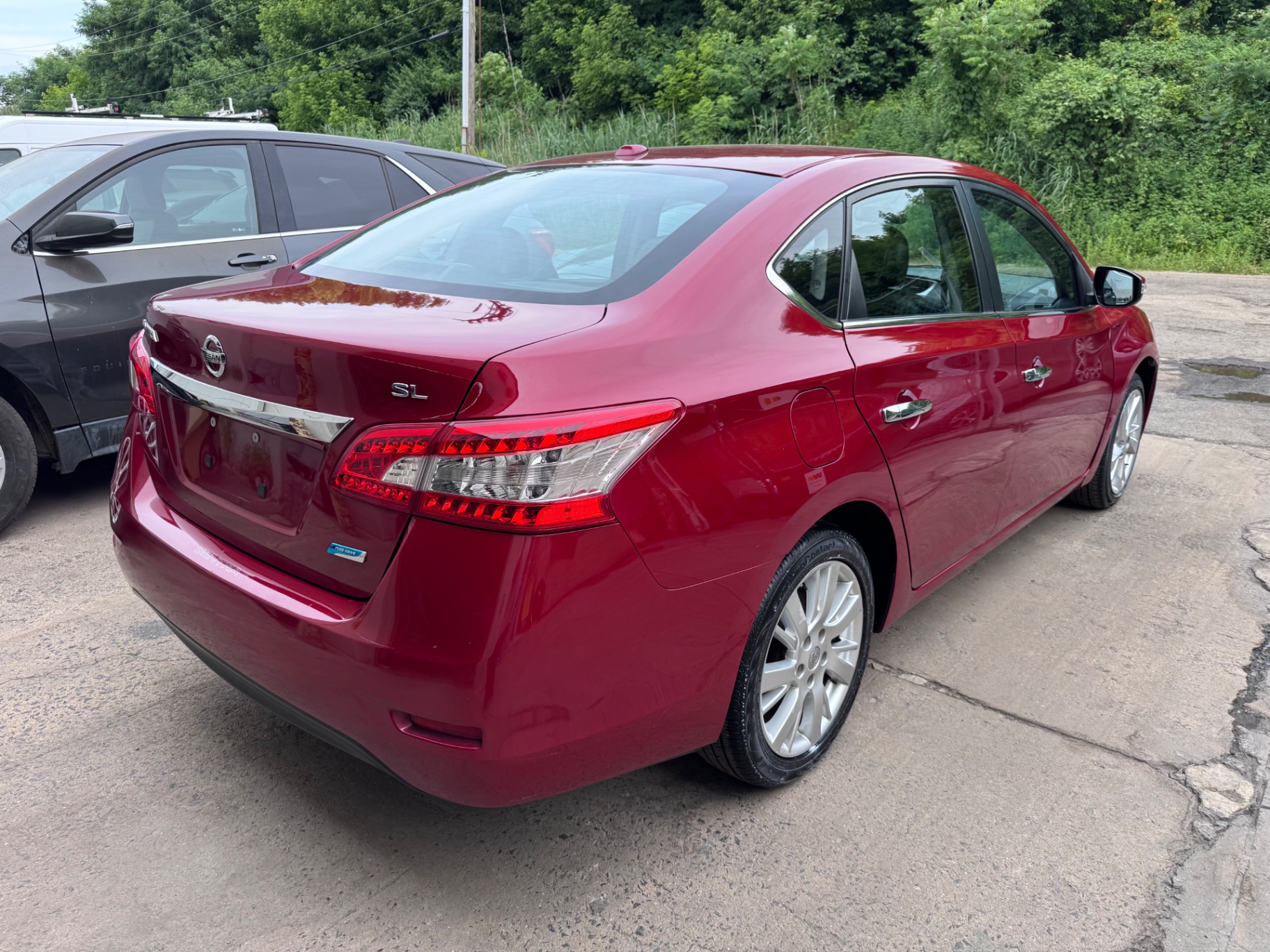 Rear view of red Nissan Sentra at the shop